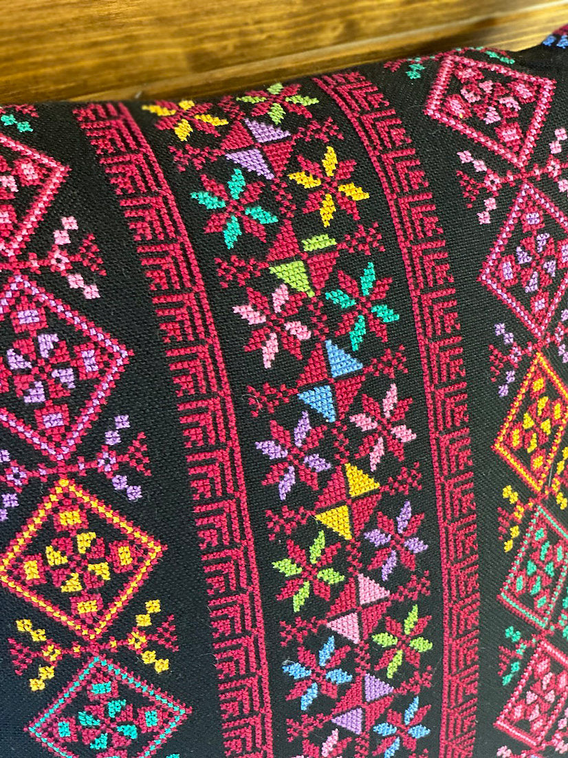 Embroidered pillows from Myanmar and Palestine